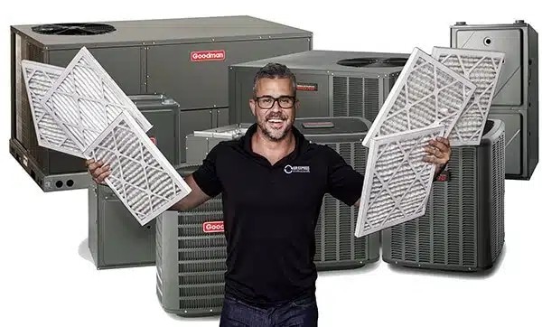 Employee holding air filters